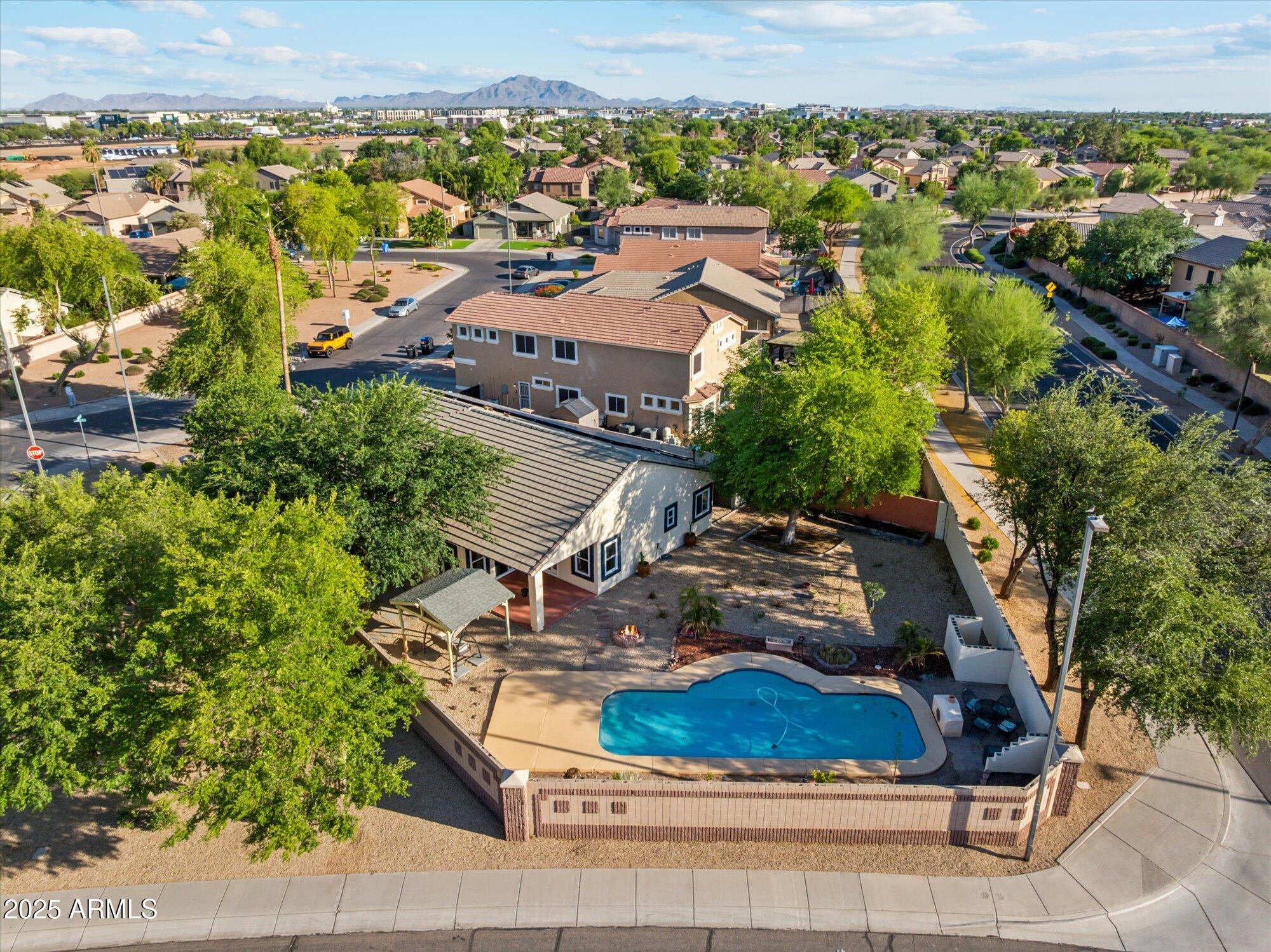 1924 South Rome Street Gilbert, AZ 85295 - Photo 20 of 60 an aerial view of a house with a yard and lake view