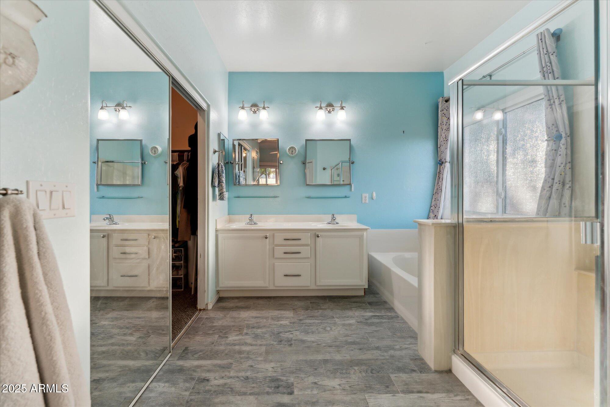 1924 South Rome Street Gilbert, AZ 85295 - Photo 38 of 60 a bathroom with a sink a mirror and a shower