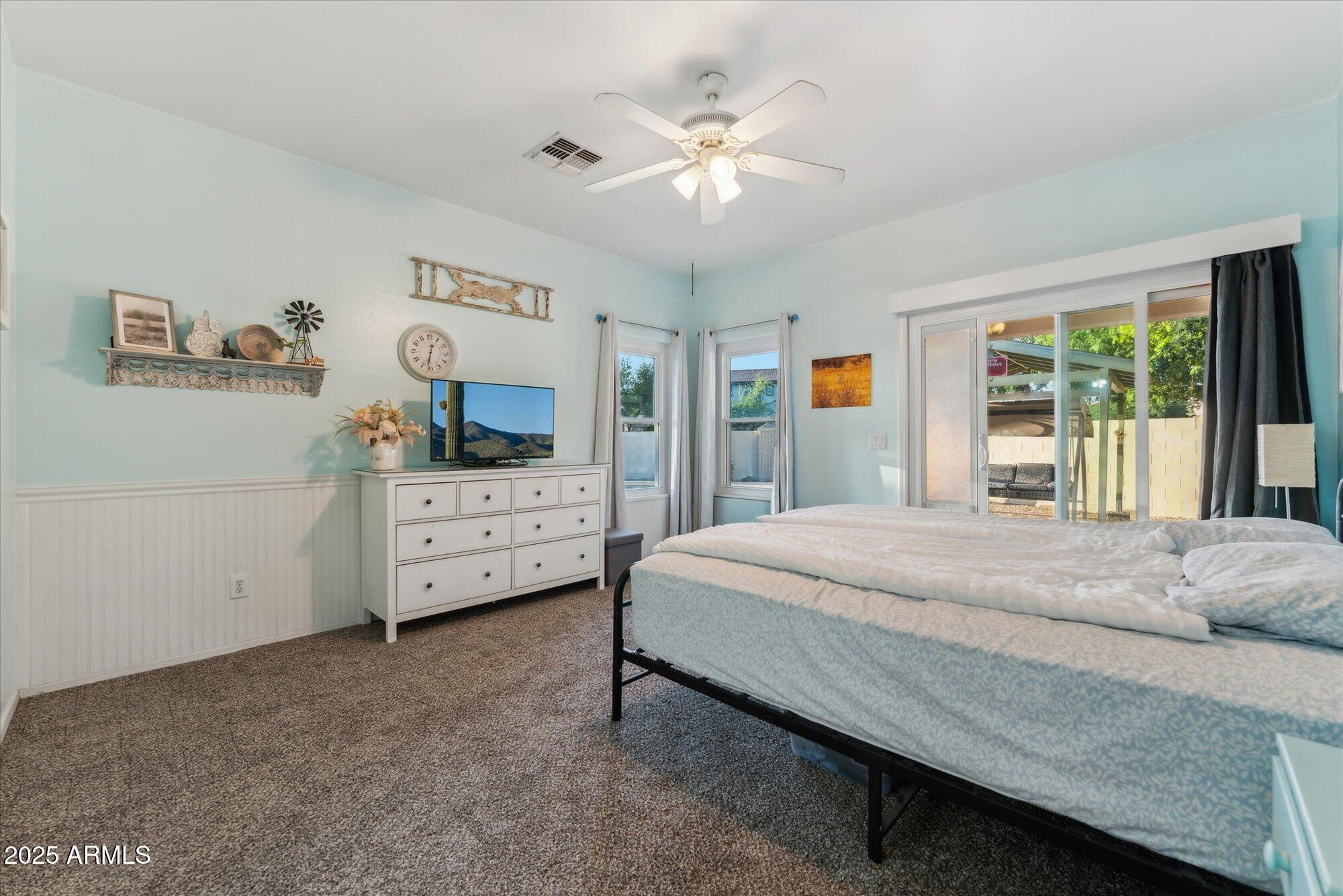 1924 South Rome Street Gilbert, AZ 85295 - Photo 40 of 60 a bedroom with a bed and a flat tv screen on dresser