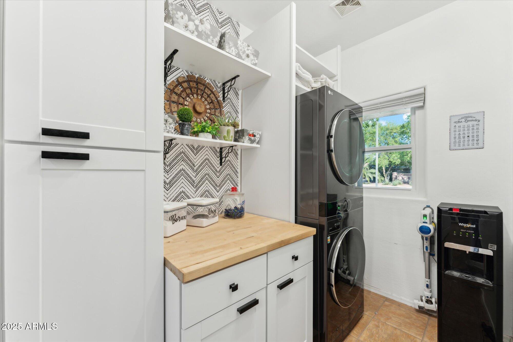 1924 South Rome Street Gilbert, AZ 85295 - Photo 43 of 60 a bathroom with a granite countertop sink a vanity and a mirror