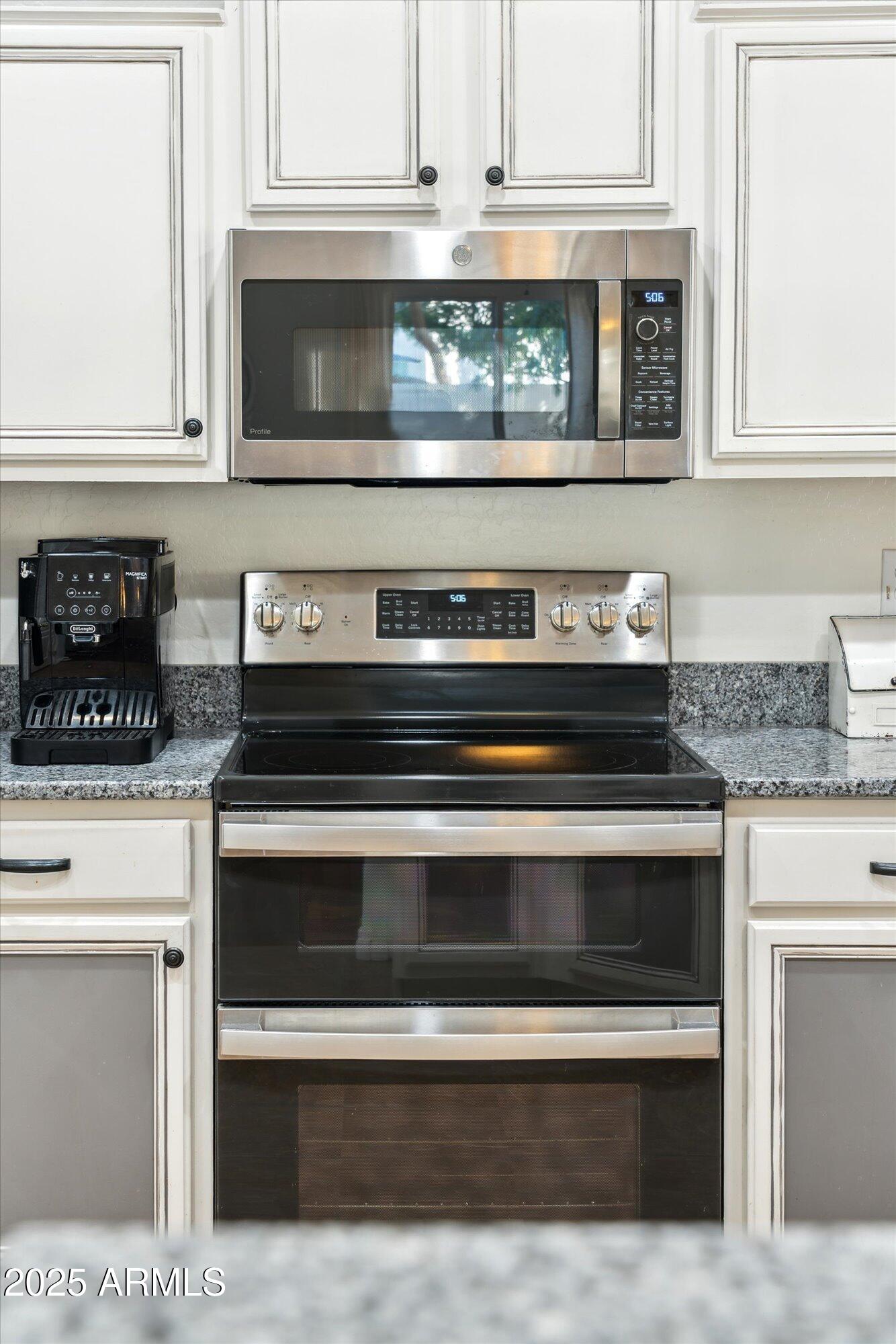1924 South Rome Street Gilbert, AZ 85295 - Photo 47 of 60 a stove top oven sitting inside of a kitchen