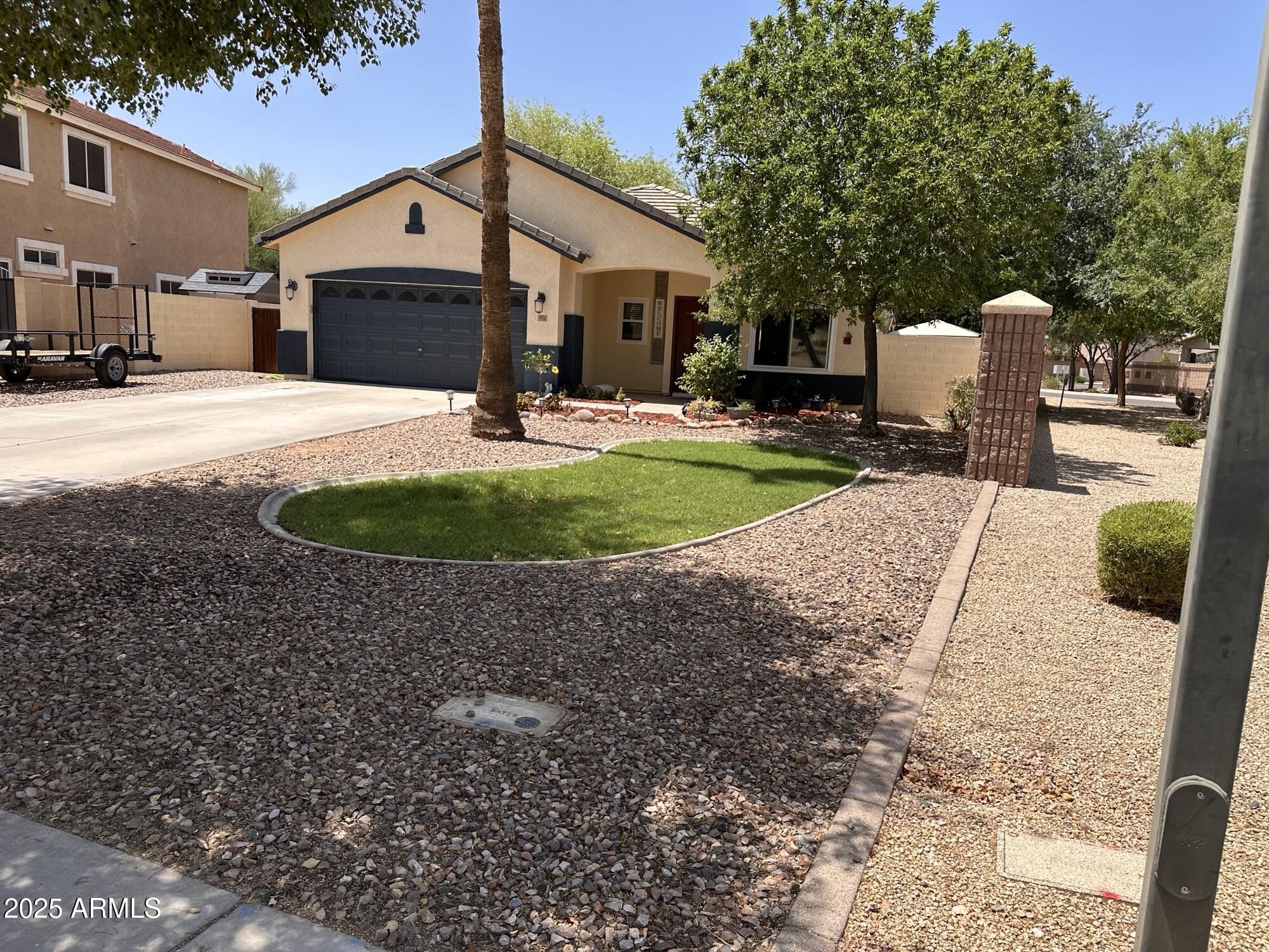 1924 South Rome Street Gilbert, AZ 85295 - Photo 57 of 60 a front view of a house with a yard and garage