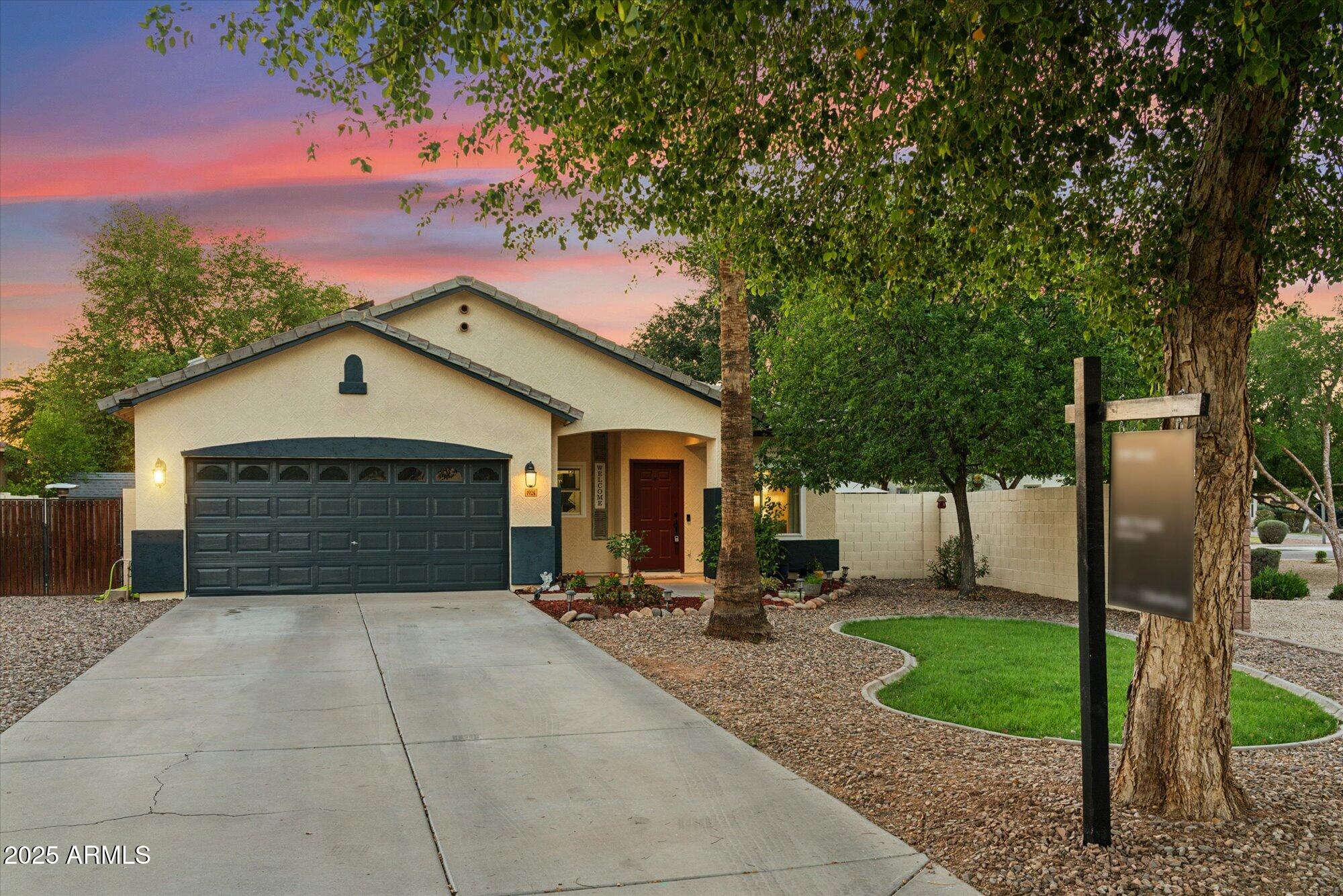 1924 South Rome Street Gilbert, AZ 85295 - Photo 58 of 60 a view of a house with a yard plants and large tree