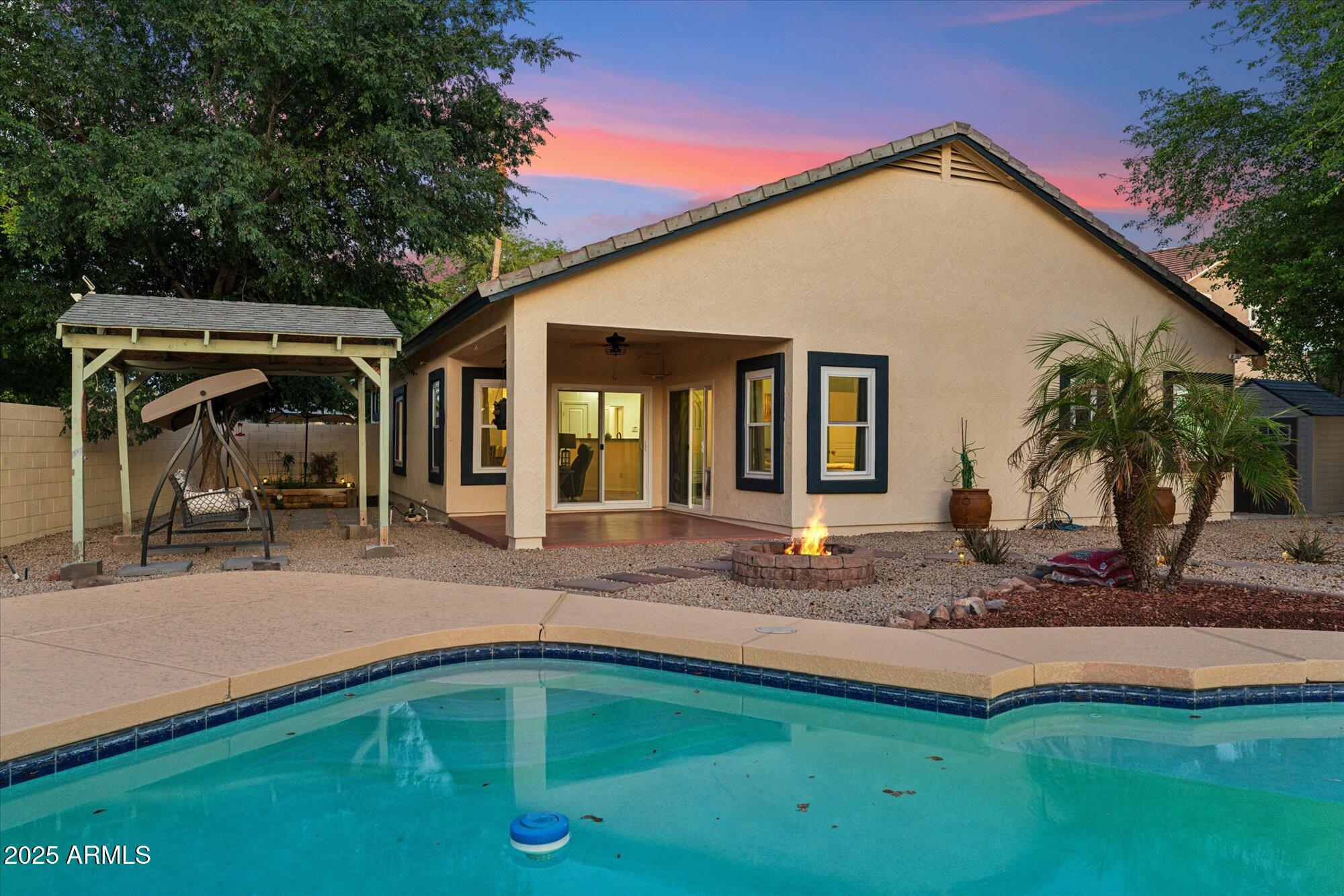 1924 South Rome Street Gilbert, AZ 85295 - Photo 8 of 60 a front view of house with yard outdoor seating and green space