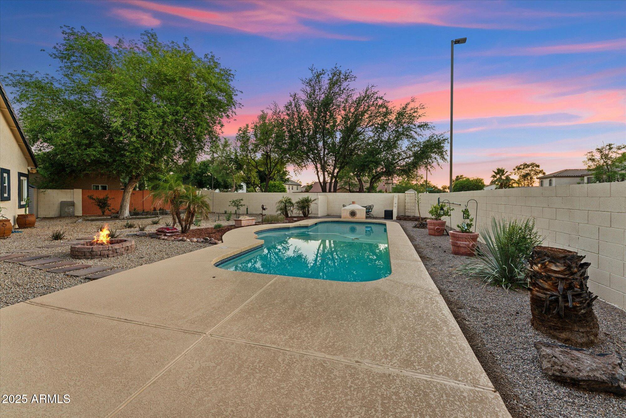 1924 South Rome Street Gilbert, AZ 85295 - Photo 9 of 60 a view of a swimming pool with a lounge chair
