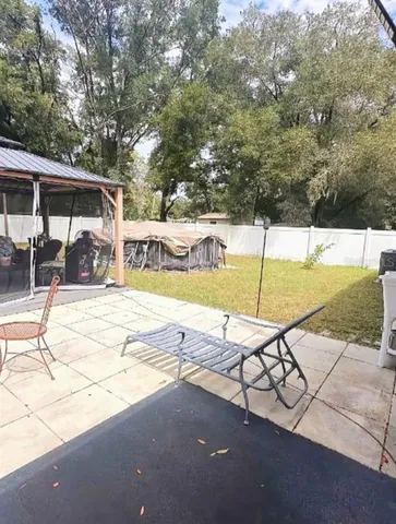 a view of a swimming pool with a patio