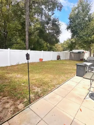 a view of a swimming pool with a chair