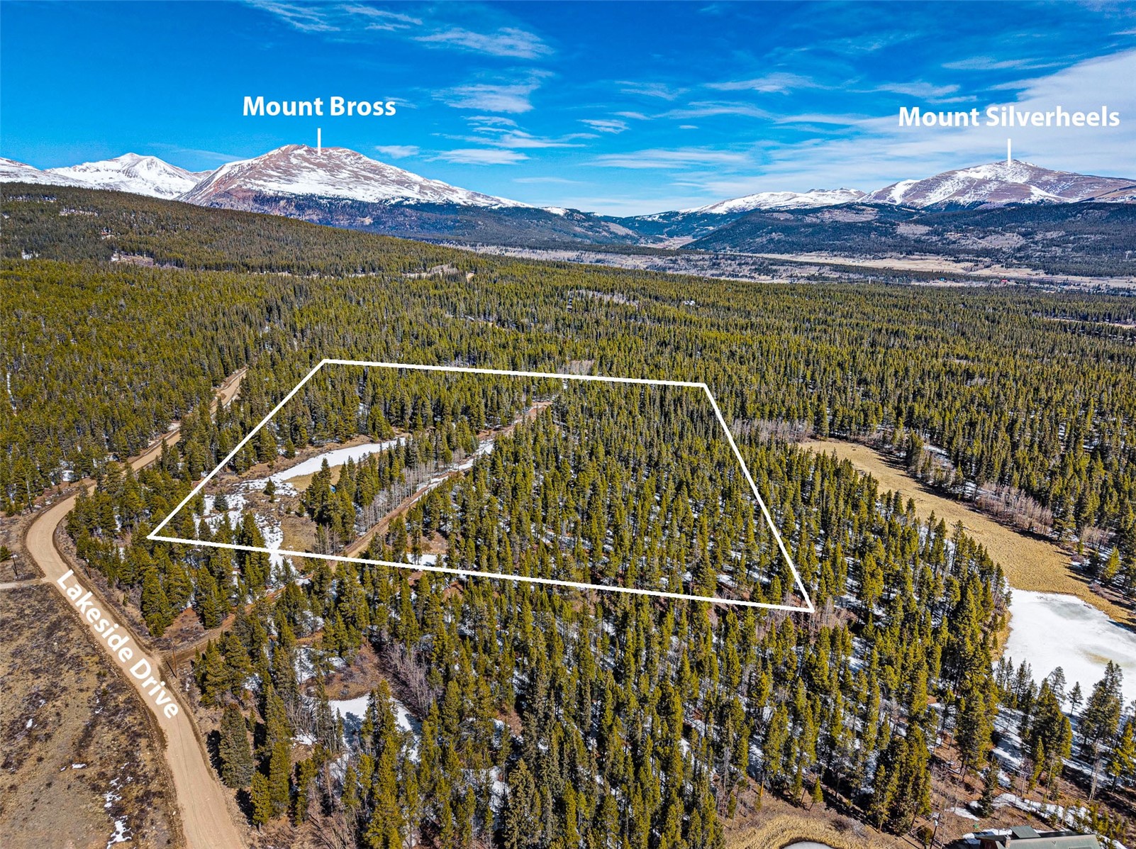 122 Arts Pike Road Fairplay, CO 80440 - Photo 41 of 50 a view of a swimming pool with a table & chairs