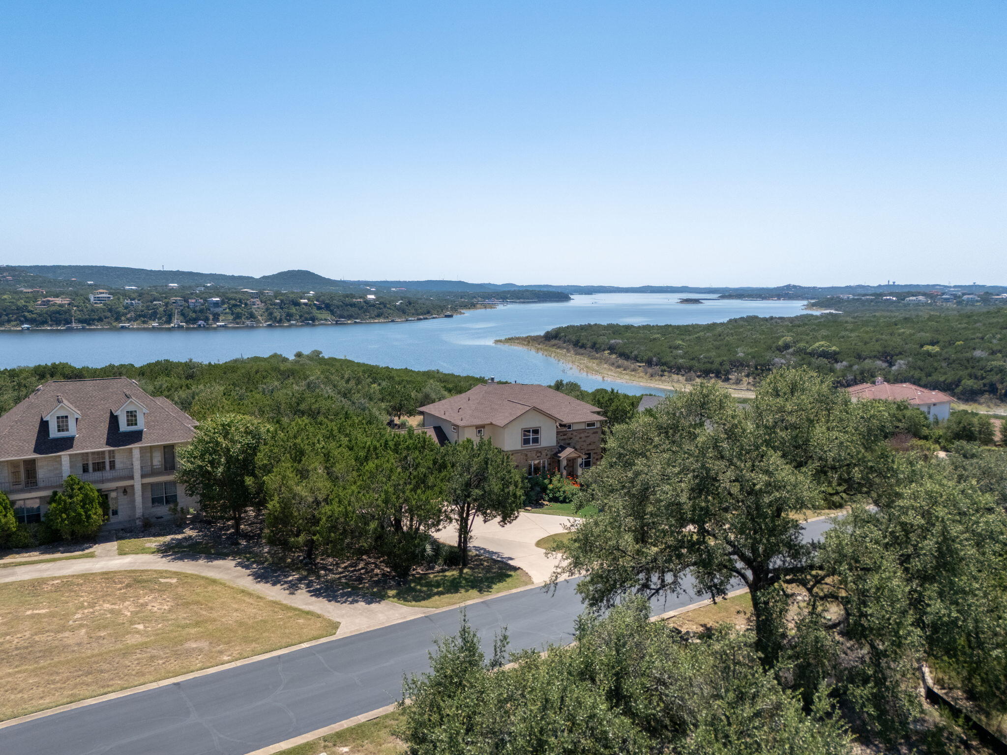 8102 Moon Rise Trail Jonestown, TX 78645 - Photo 19 of 33 an aerial view of lake and residential houses with outdoor space