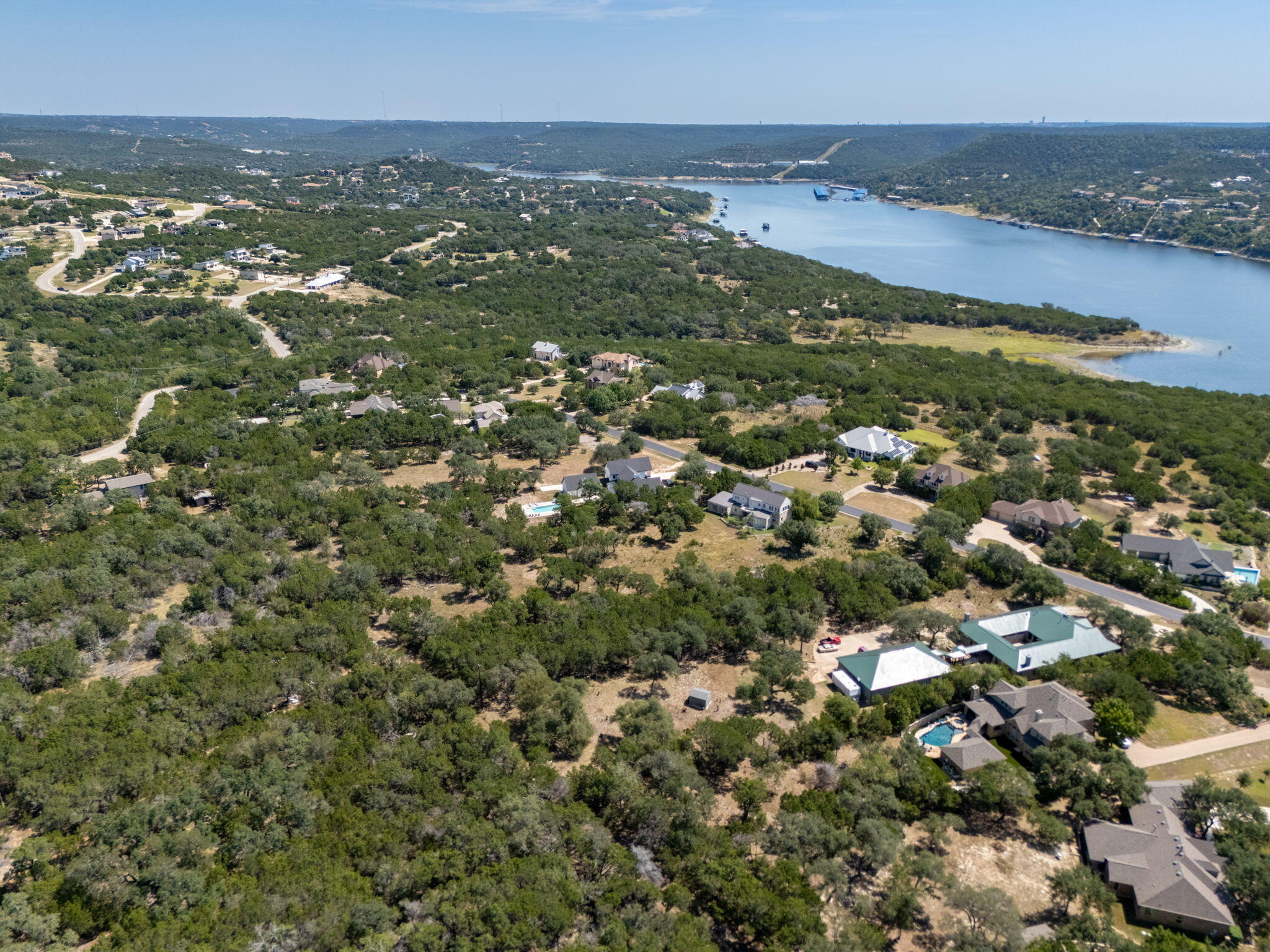8102 Moon Rise Trail Jonestown, TX 78645 - Photo 25 of 33 an aerial view of residential houses with outdoor space and trees