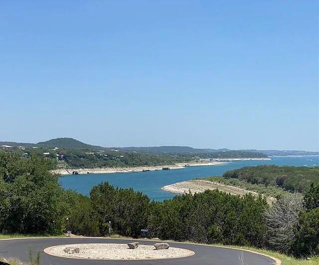 8102 Moon Rise Trail Jonestown, TX 78645 - Photo 32 of 33 a view of a lake with houses