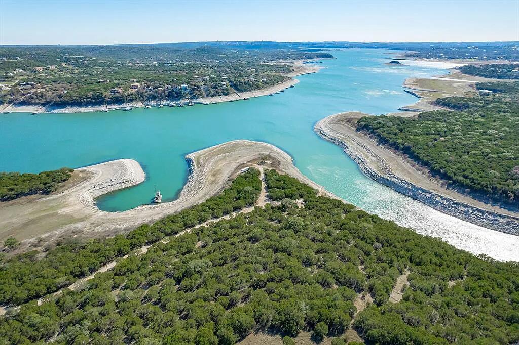 8102 Moon Rise Trail Jonestown, TX 78645 - Photo 8 of 33 a view of a lake with a sink