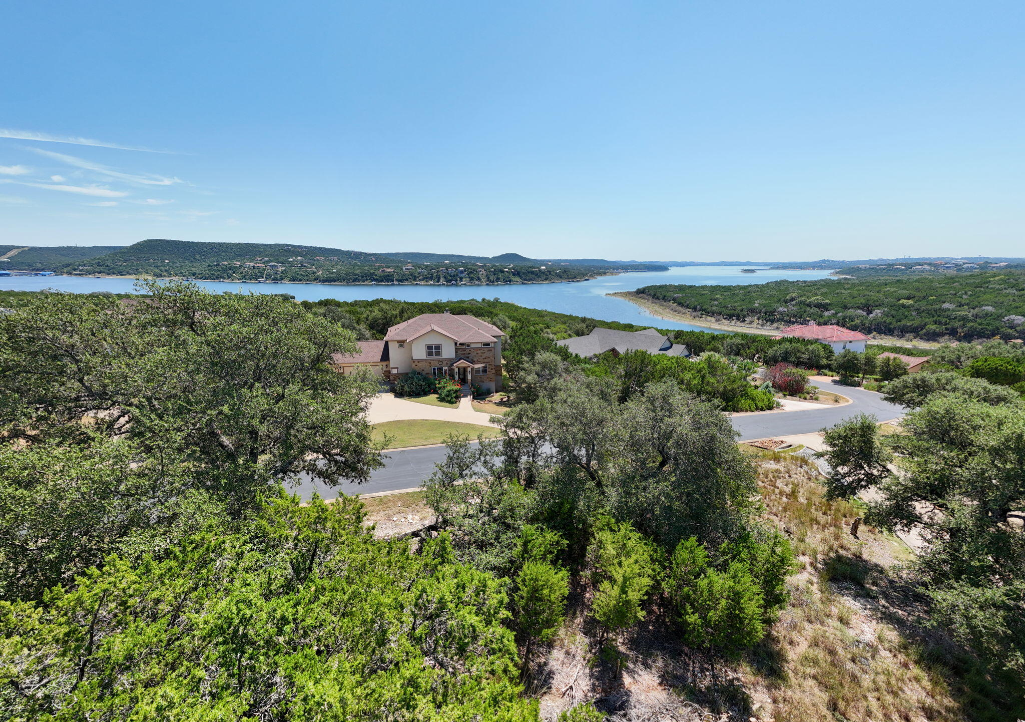 8102 Moon Rise Trail Jonestown, TX 78645 - Photo 10 of 33 a view of a lake with a mountain in the back
