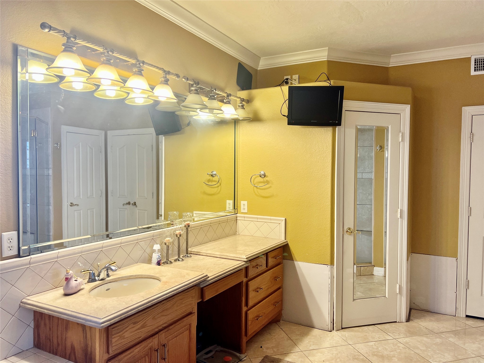 3301 Roya Court Port Arthur, TX 77642 - Photo 17 of 40 a bathroom with a sink a mirror a vanity and a shower