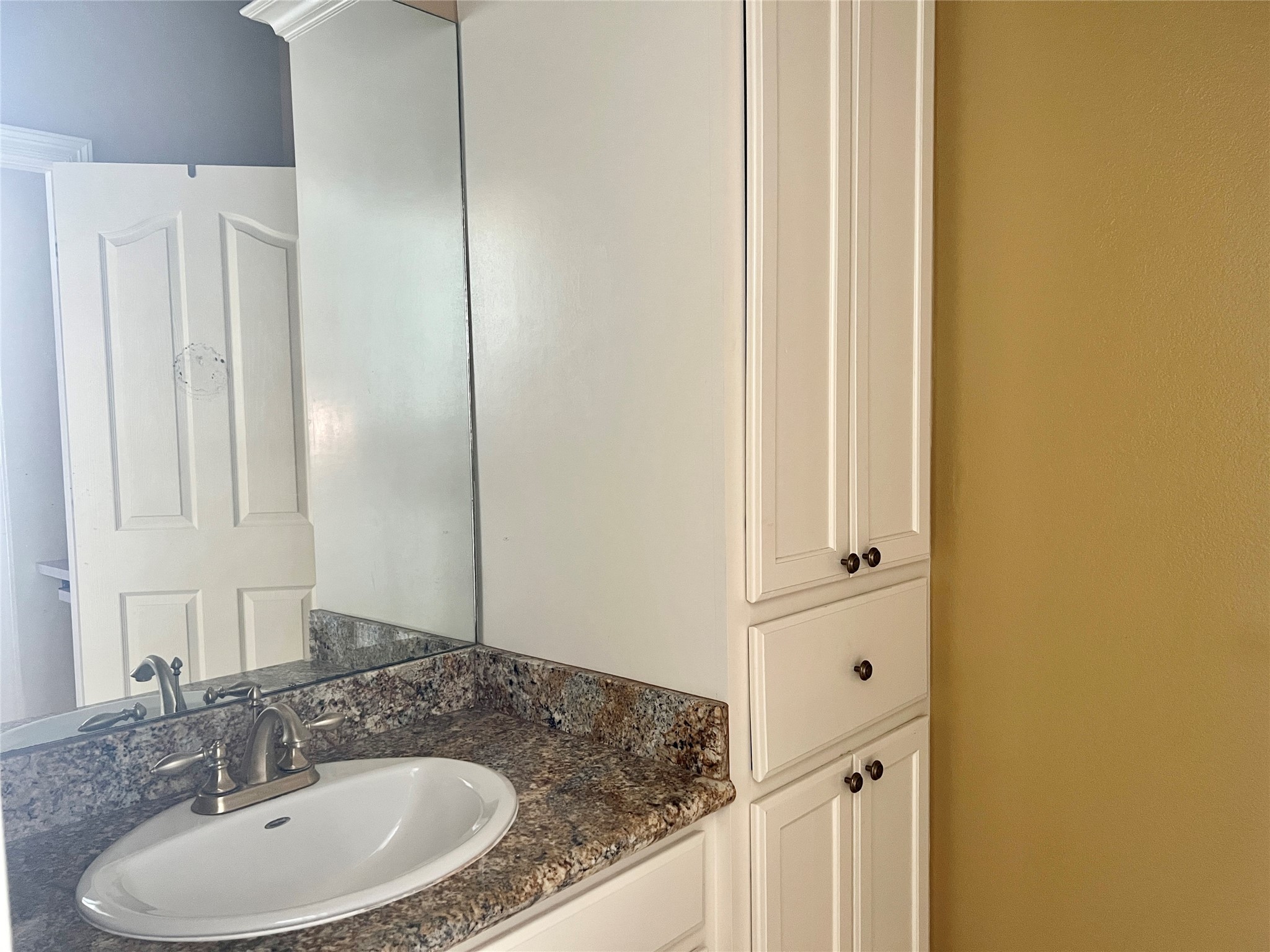 3301 Roya Court Port Arthur, TX 77642 - Photo 22 of 40 a bathroom with a granite countertop sink and a mirror