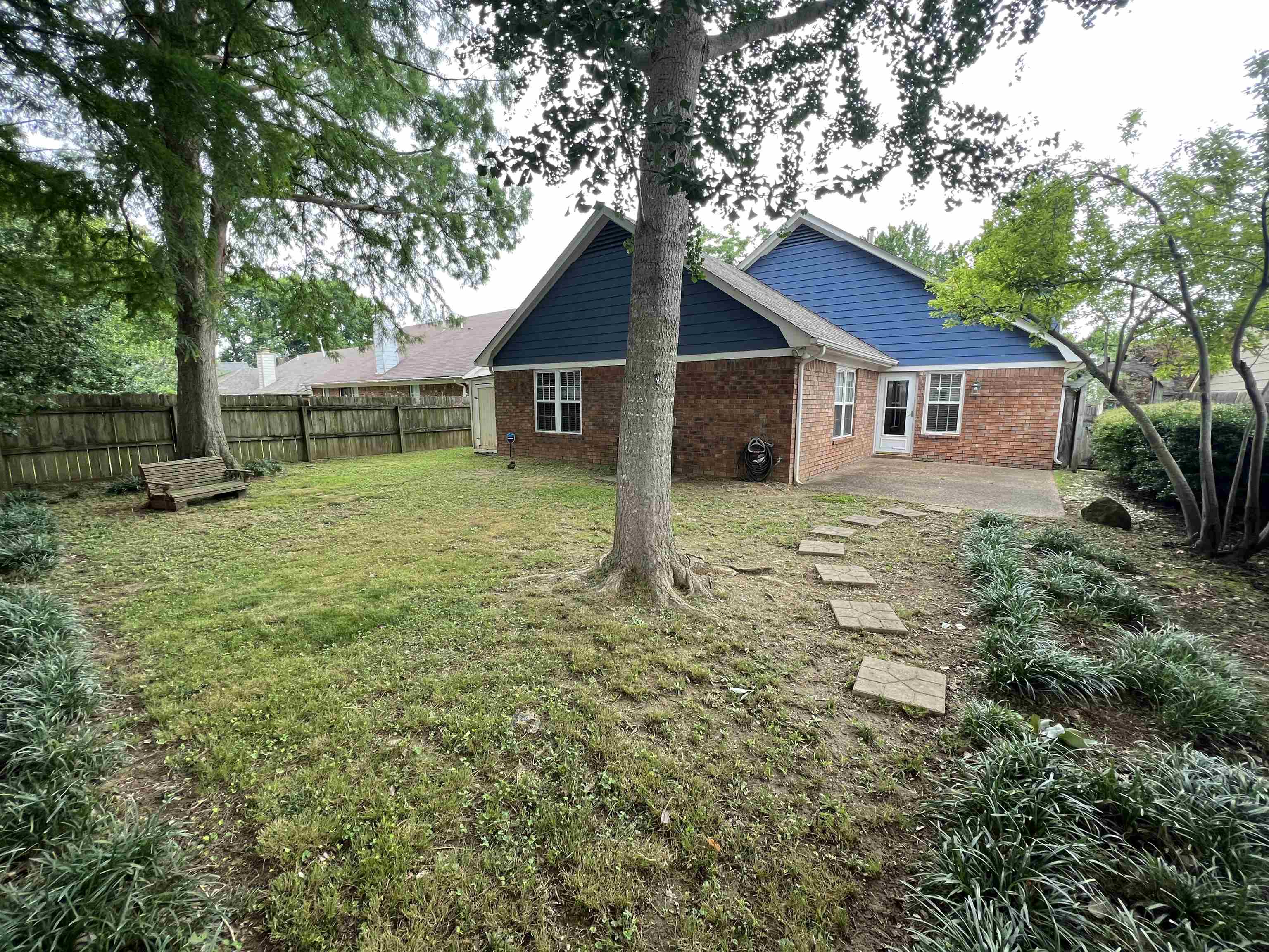 7429 Gingerhill Lane Bartlett, TN 38133 - Photo 14 of 20 a house with trees in the background