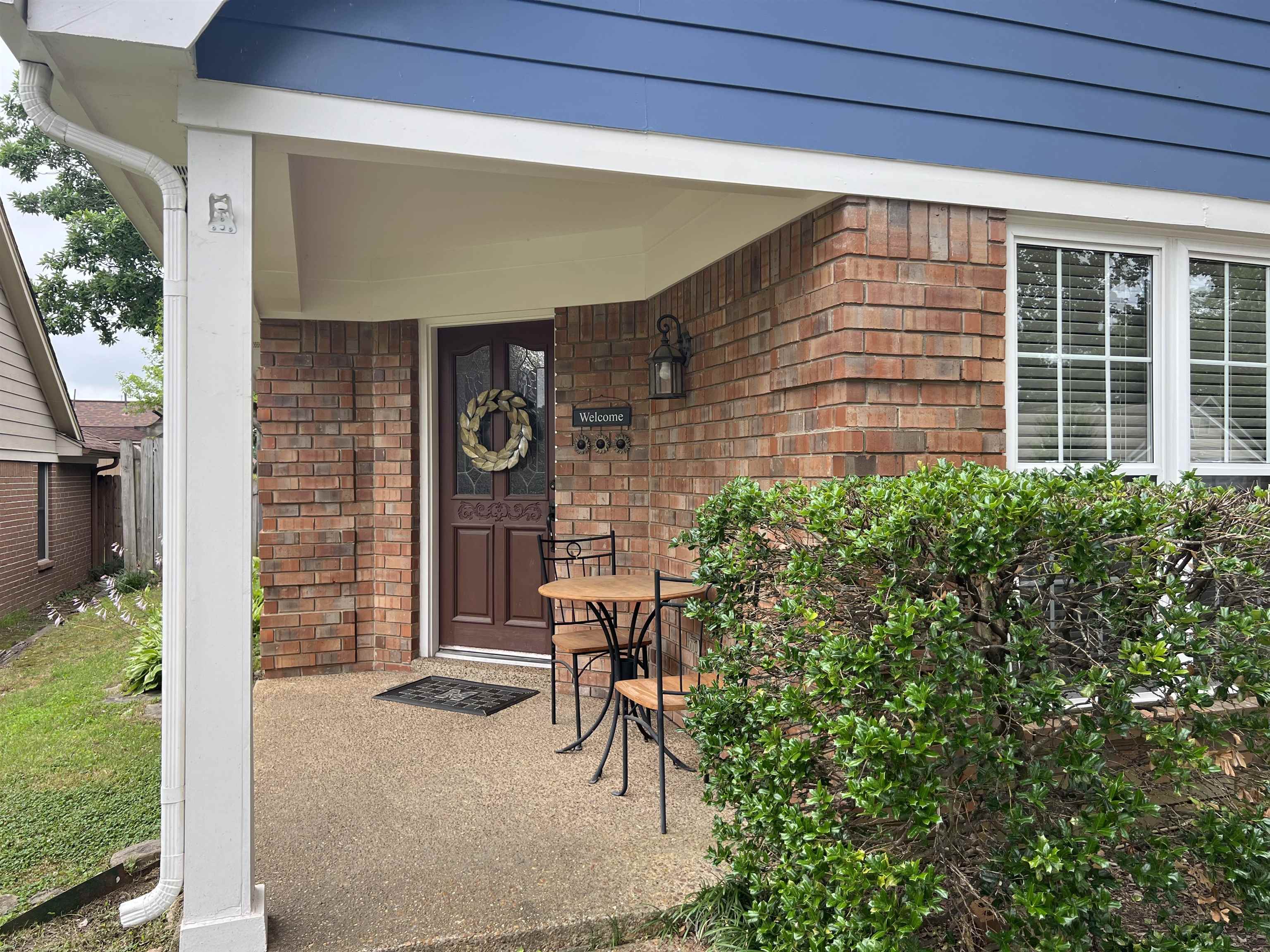 7429 Gingerhill Lane Bartlett, TN 38133 - Photo 2 of 20 a front view of a house with a yard