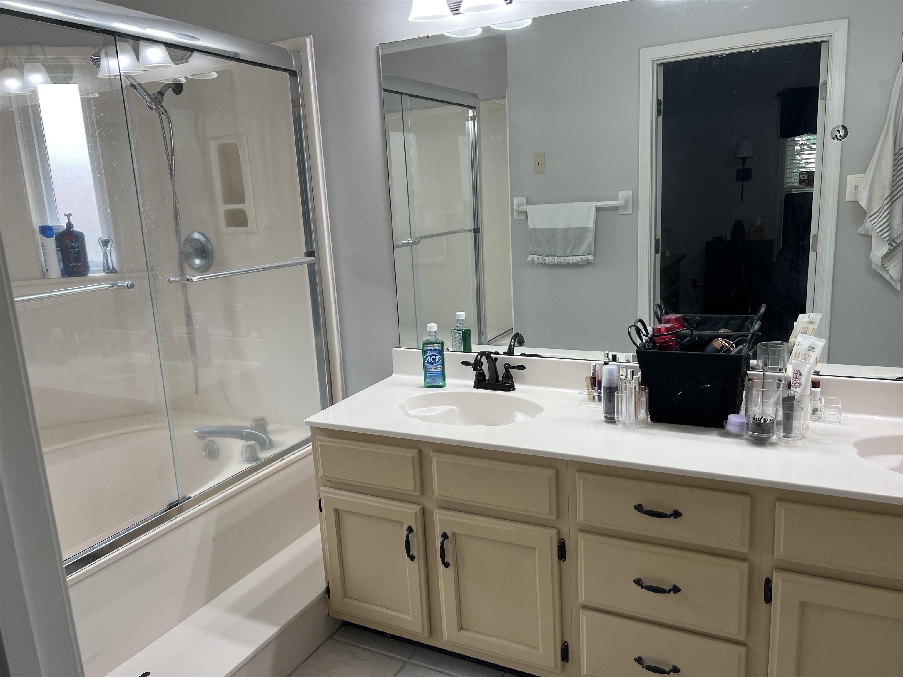 7429 Gingerhill Lane Bartlett, TN 38133 - Photo 8 of 20 a bathroom with a double vanity sink mirror and shower
