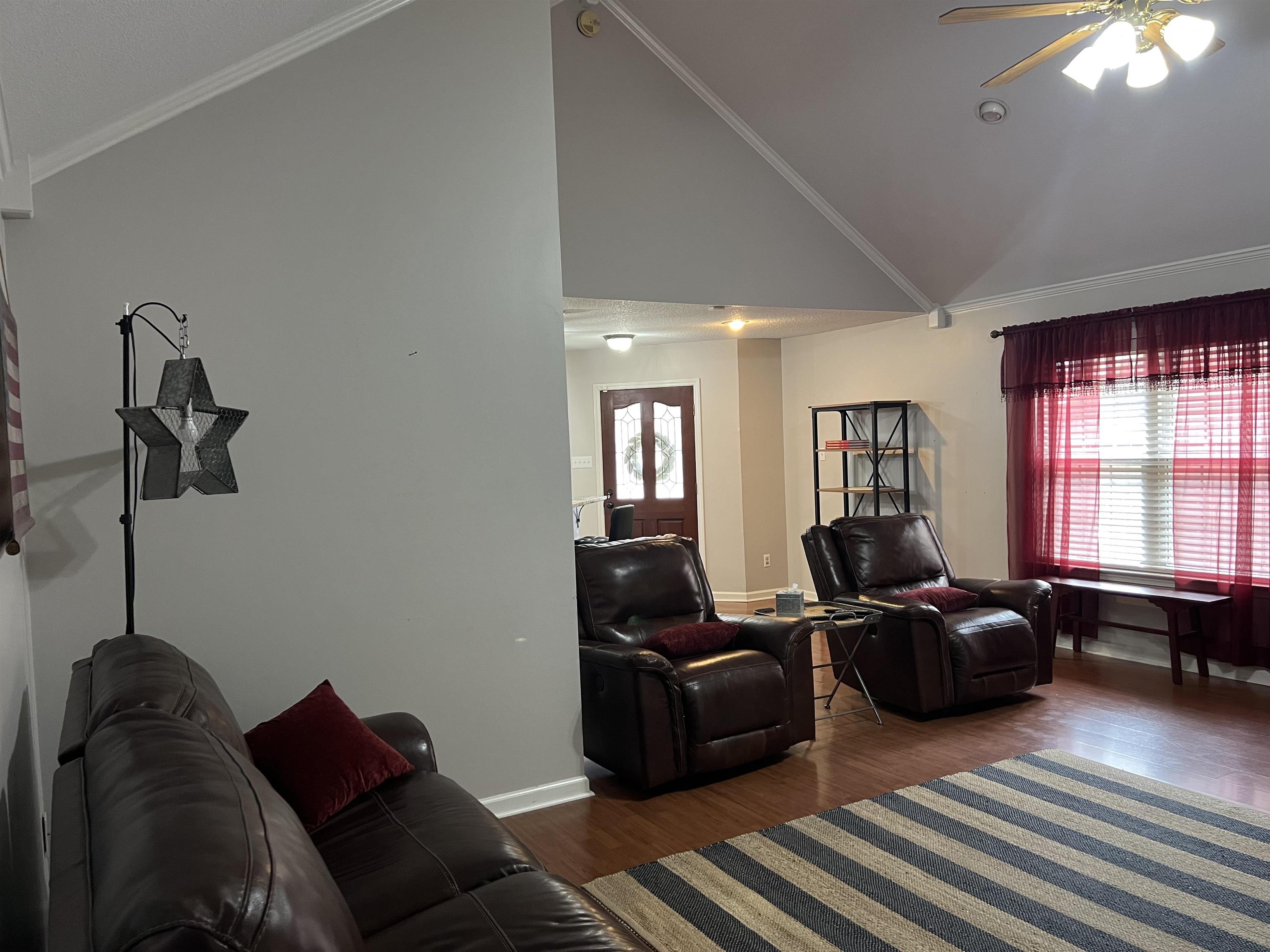 7429 Gingerhill Lane Bartlett, TN 38133 - Photo 10 of 20 a living room with furniture and a window
