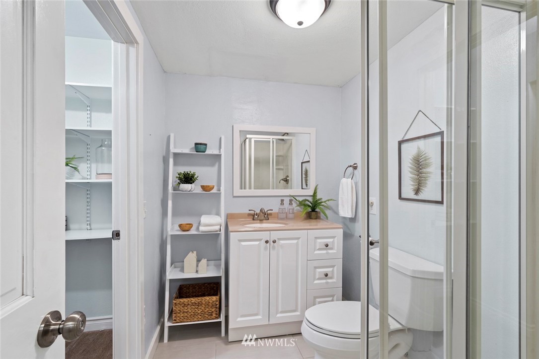 20906 30th Drive Southeast Bothell, WA 98021 - Photo 22 of 25 a bathroom with a toilet a sink and shower