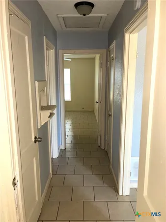 a bathroom with a granite countertop shower and a sink