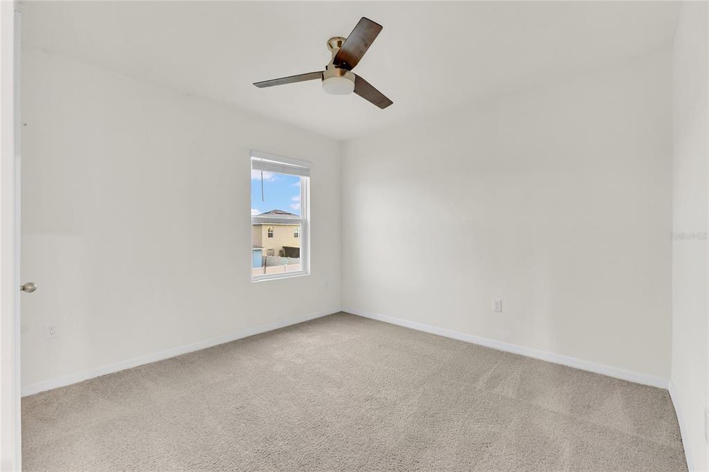 641 Talisi Loop St. Cloud, FL 34771 - Photo 15 of 40 a view of room with a ceiling fan and window