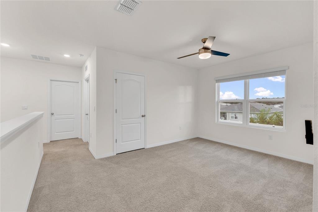 641 Talisi Loop St. Cloud, FL 34771 - Photo 20 of 40 a view of an empty room with a window