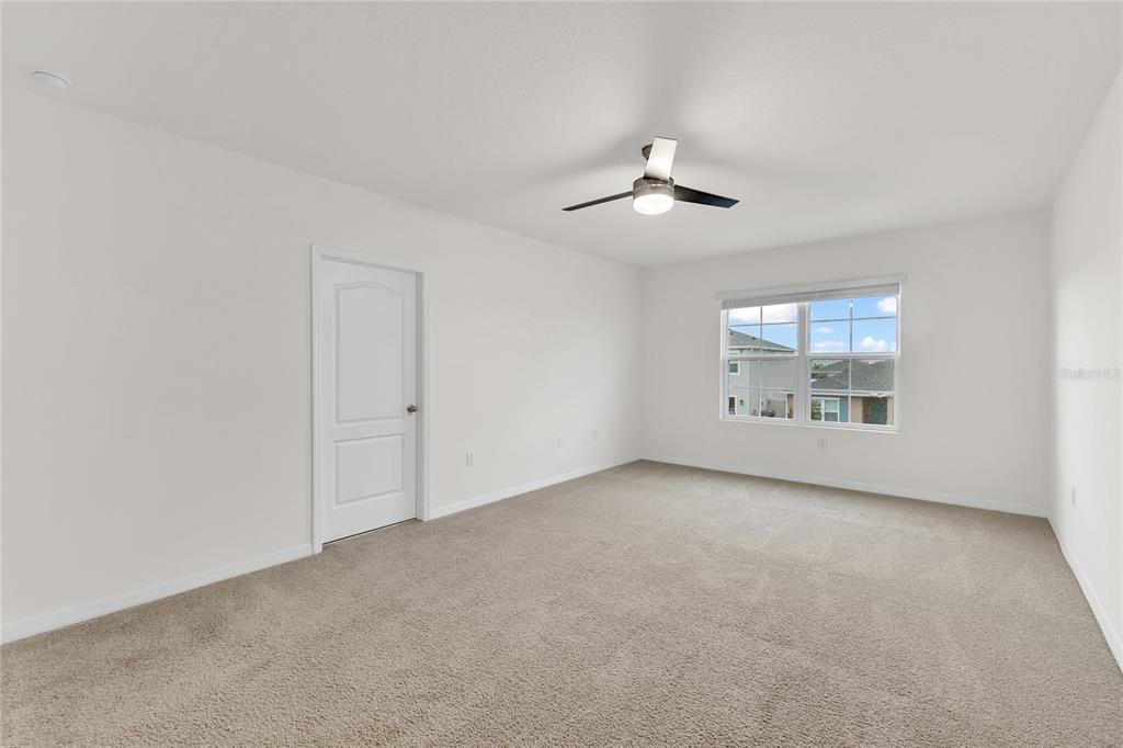 641 Talisi Loop St. Cloud, FL 34771 - Photo 21 of 40 an empty room with a empty space and windows