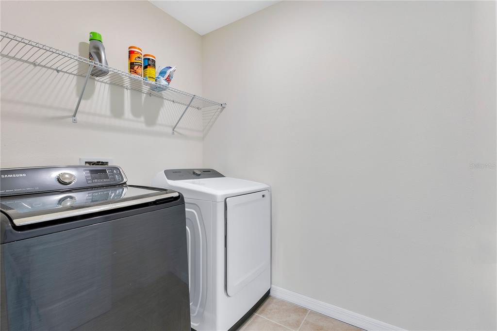 641 Talisi Loop St. Cloud, FL 34771 - Photo 25 of 40 a utility room with dryer and washer