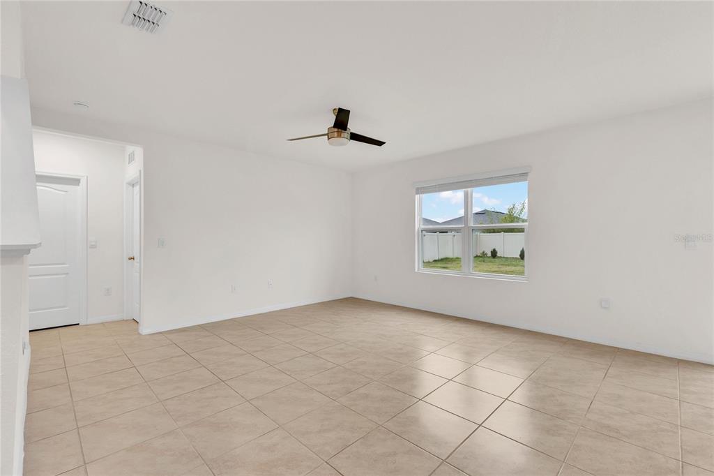 641 Talisi Loop St. Cloud, FL 34771 - Photo 3 of 40 an empty room with windows
