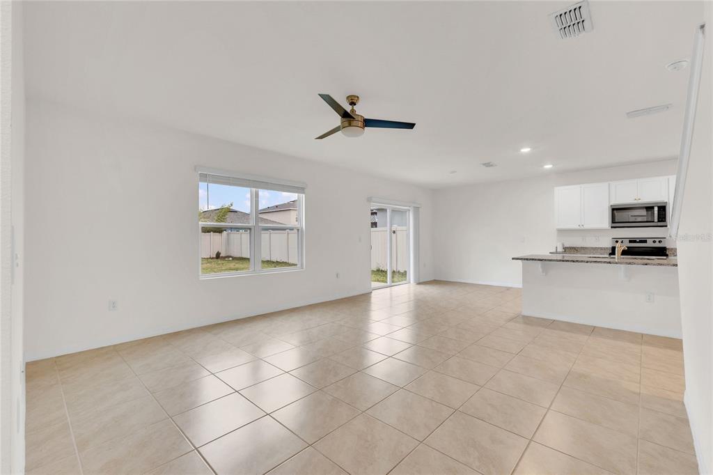641 Talisi Loop St. Cloud, FL 34771 - Photo 9 of 40 a view of an empty room with a window