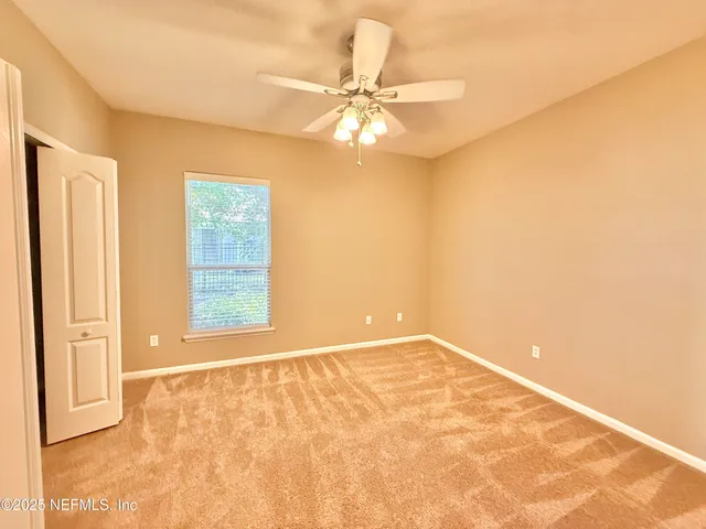 an aerial view of residential houses with outdoor space and street view