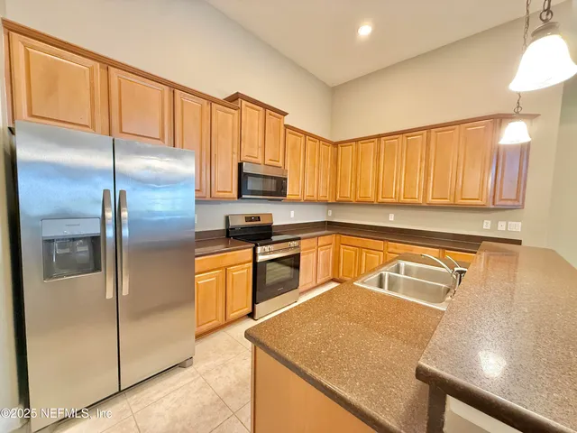 a view of a livingroom with furniture and a chandelier