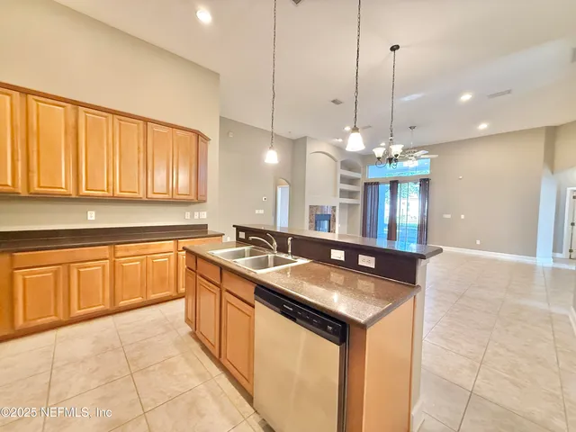 a bathroom with a bathtub shower sink and mirror