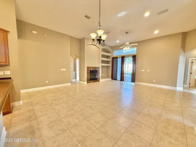 a bathroom with a tub a sink a mirror and shower