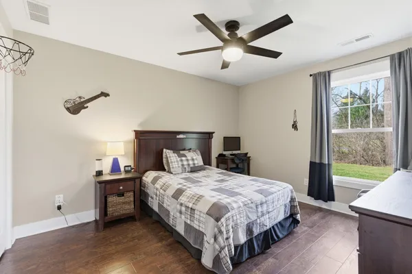 a bedroom with a bed furniture and a window
