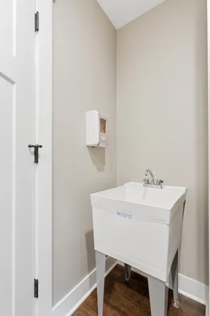 a bathroom with a toilet a sink and a mirror