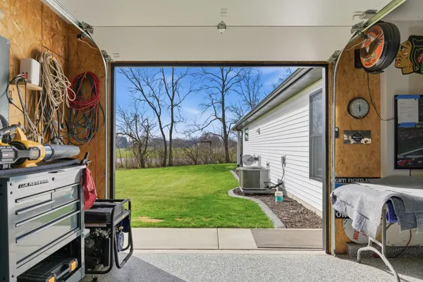 a view of a patio with chairs and a table