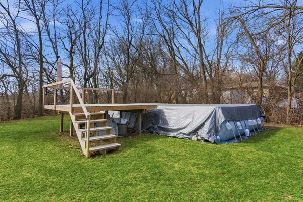 a front view of house with a garden