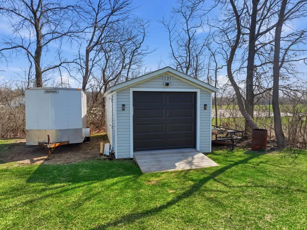 front view of a house with a tree