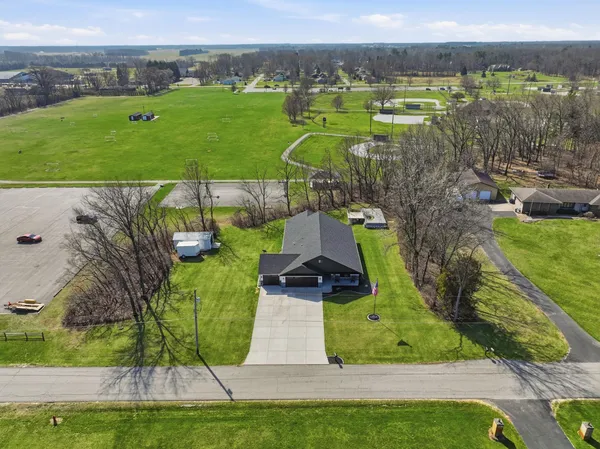 an aerial view of a house with a garden