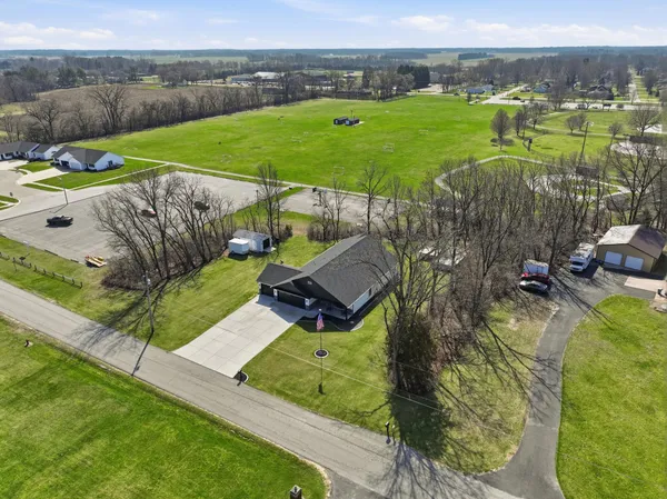 a view of a hallway with the wooden shelves