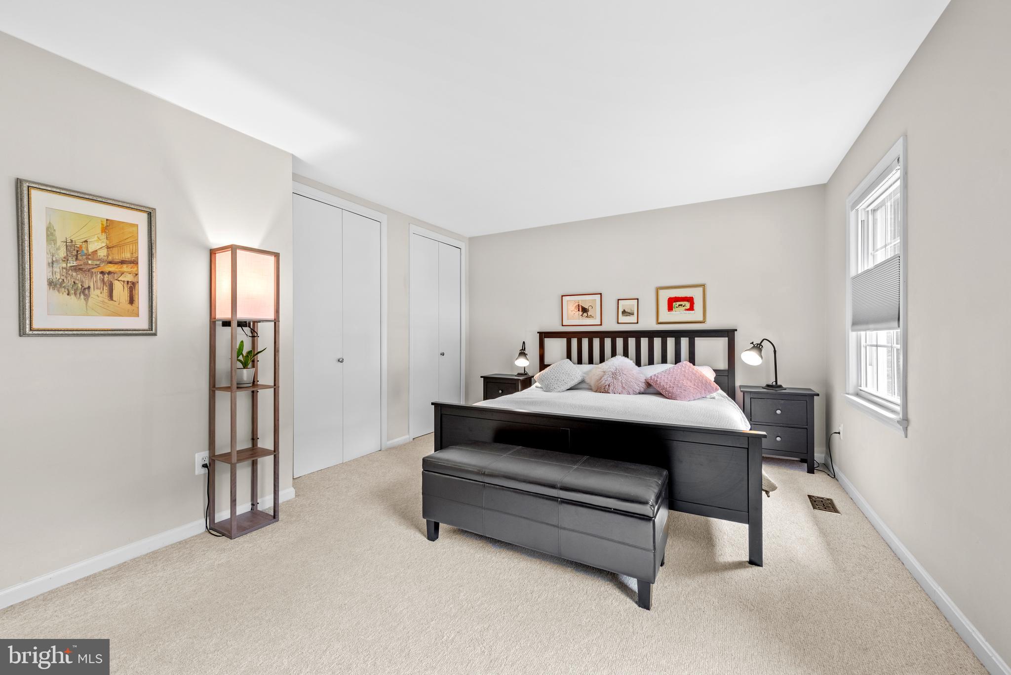 11612 Clipstone Lane Reston, VA 20191 - Photo 15 of 51 a spacious bedroom with a bed and a table