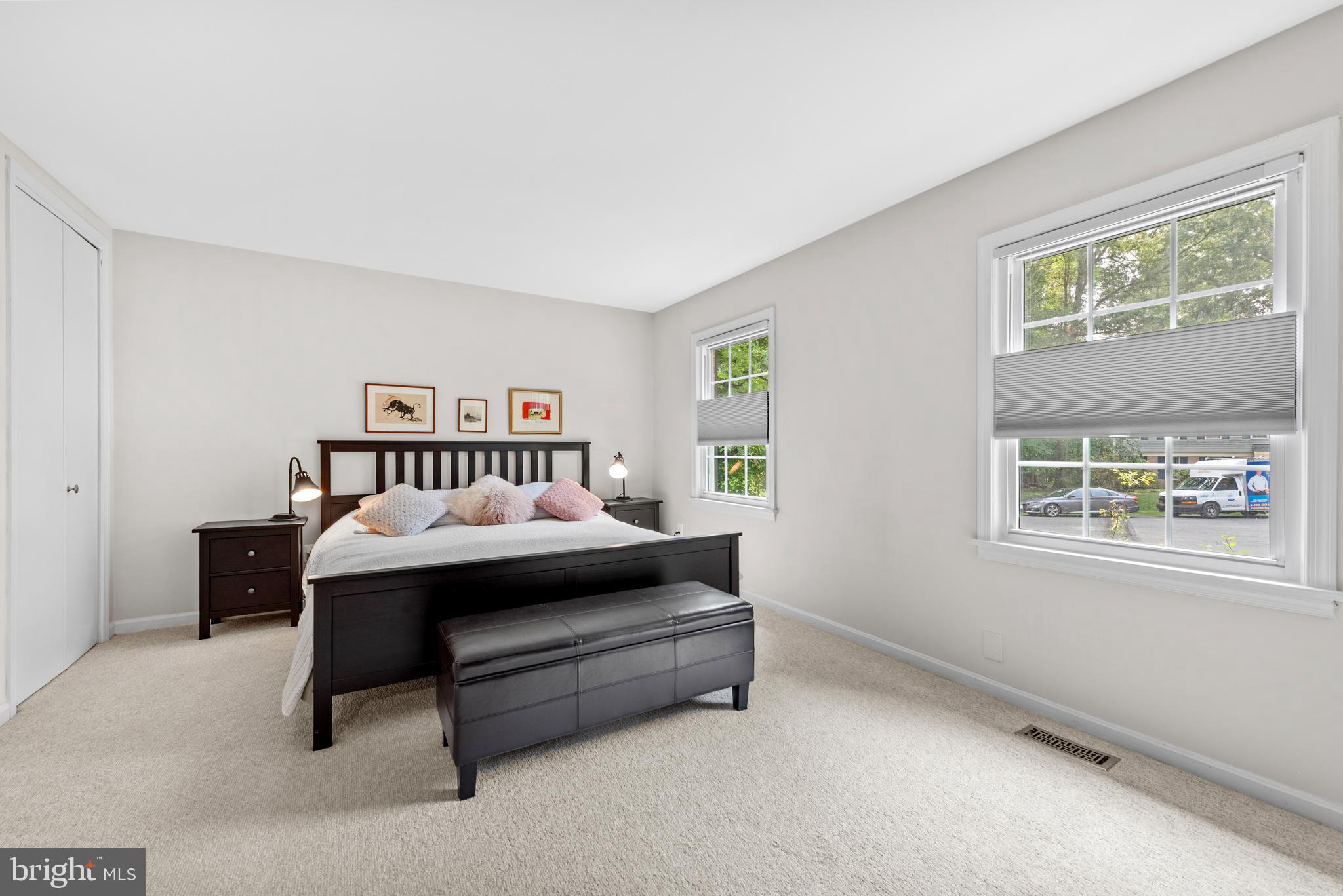 11612 Clipstone Lane Reston, VA 20191 - Photo 16 of 51 a spacious bedroom with a bed and a window