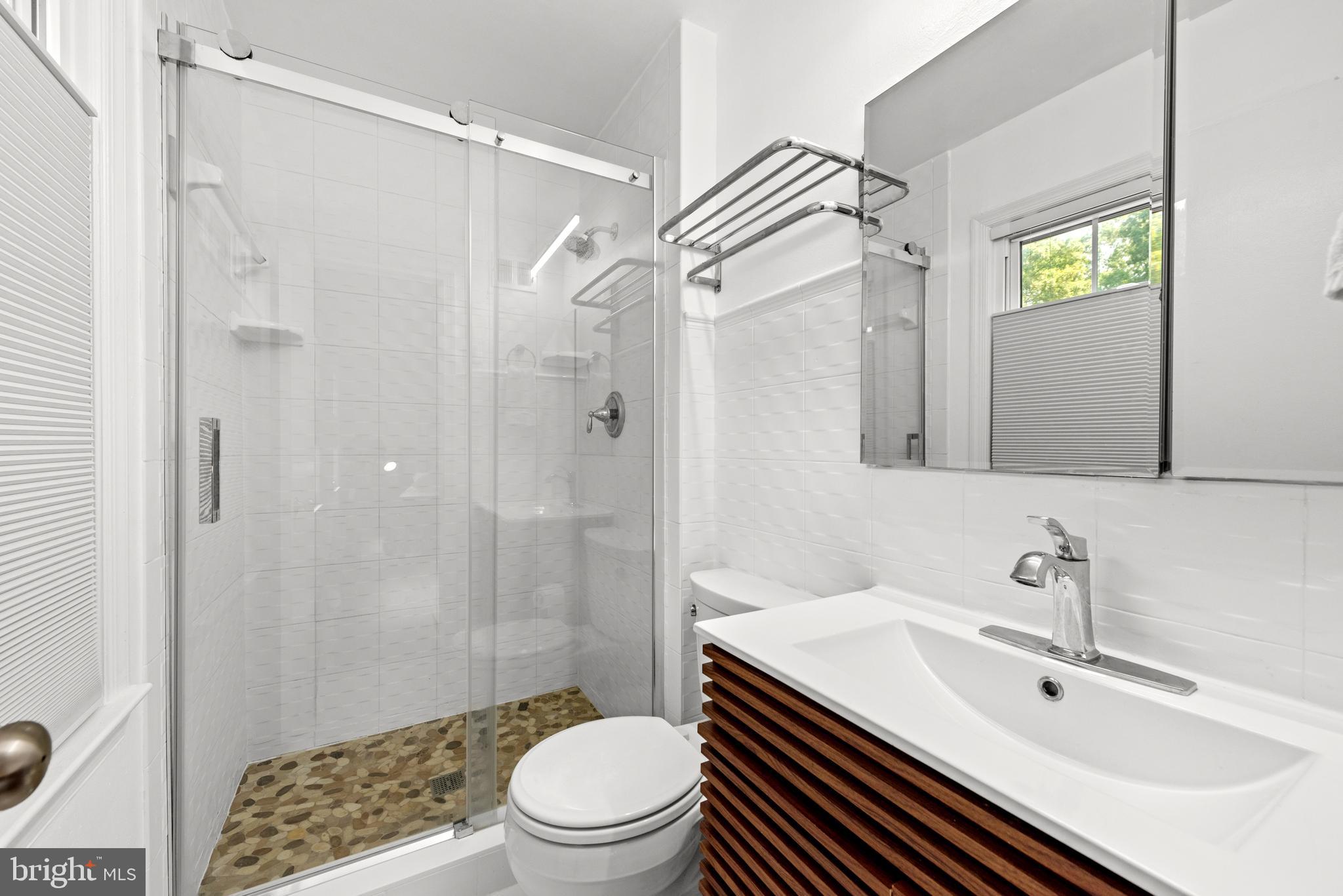 11612 Clipstone Lane Reston, VA 20191 - Photo 17 of 51 a bathroom with a sink a toilet and shower