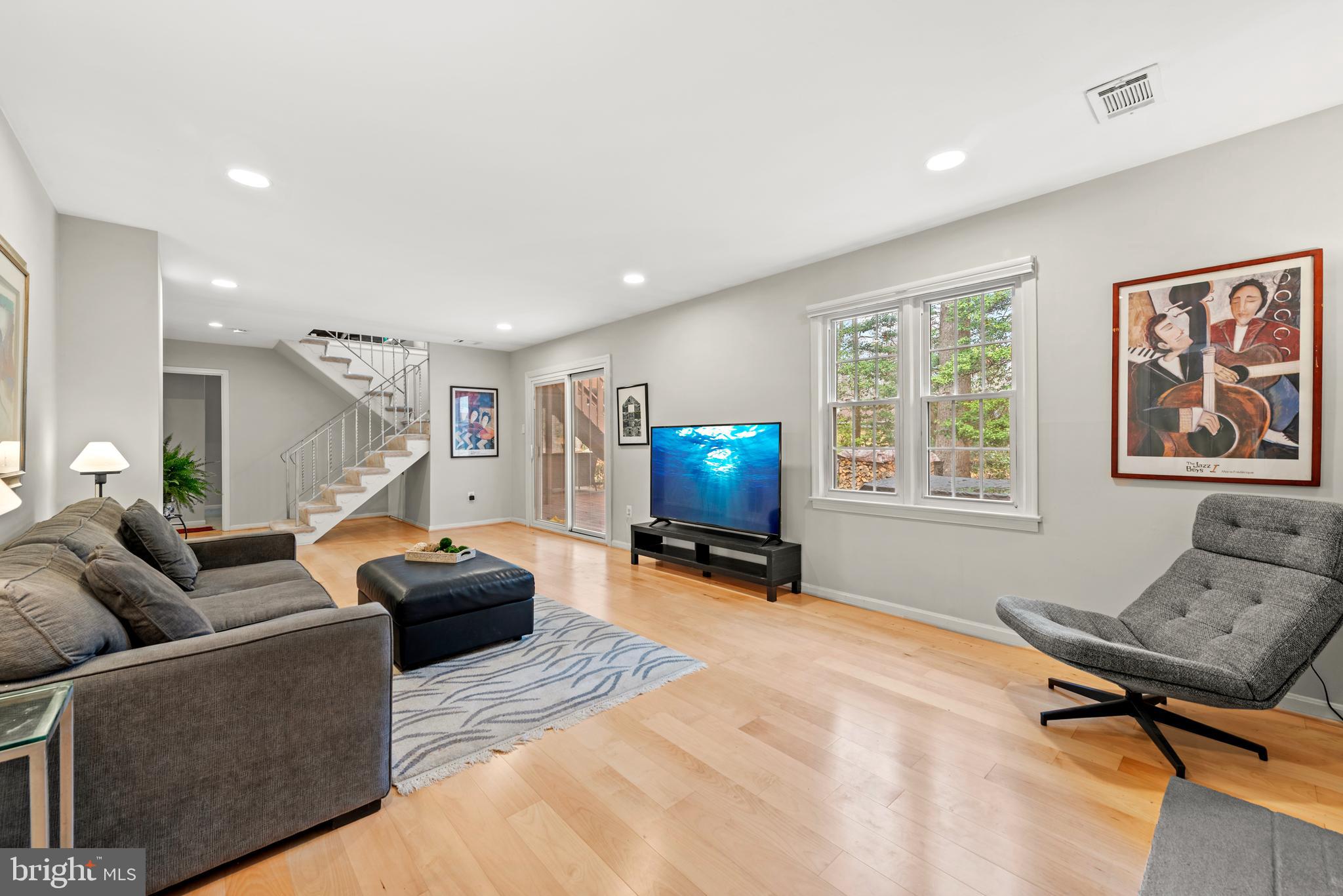 11612 Clipstone Lane Reston, VA 20191 - Photo 21 of 51 a living room with furniture and a flat screen tv
