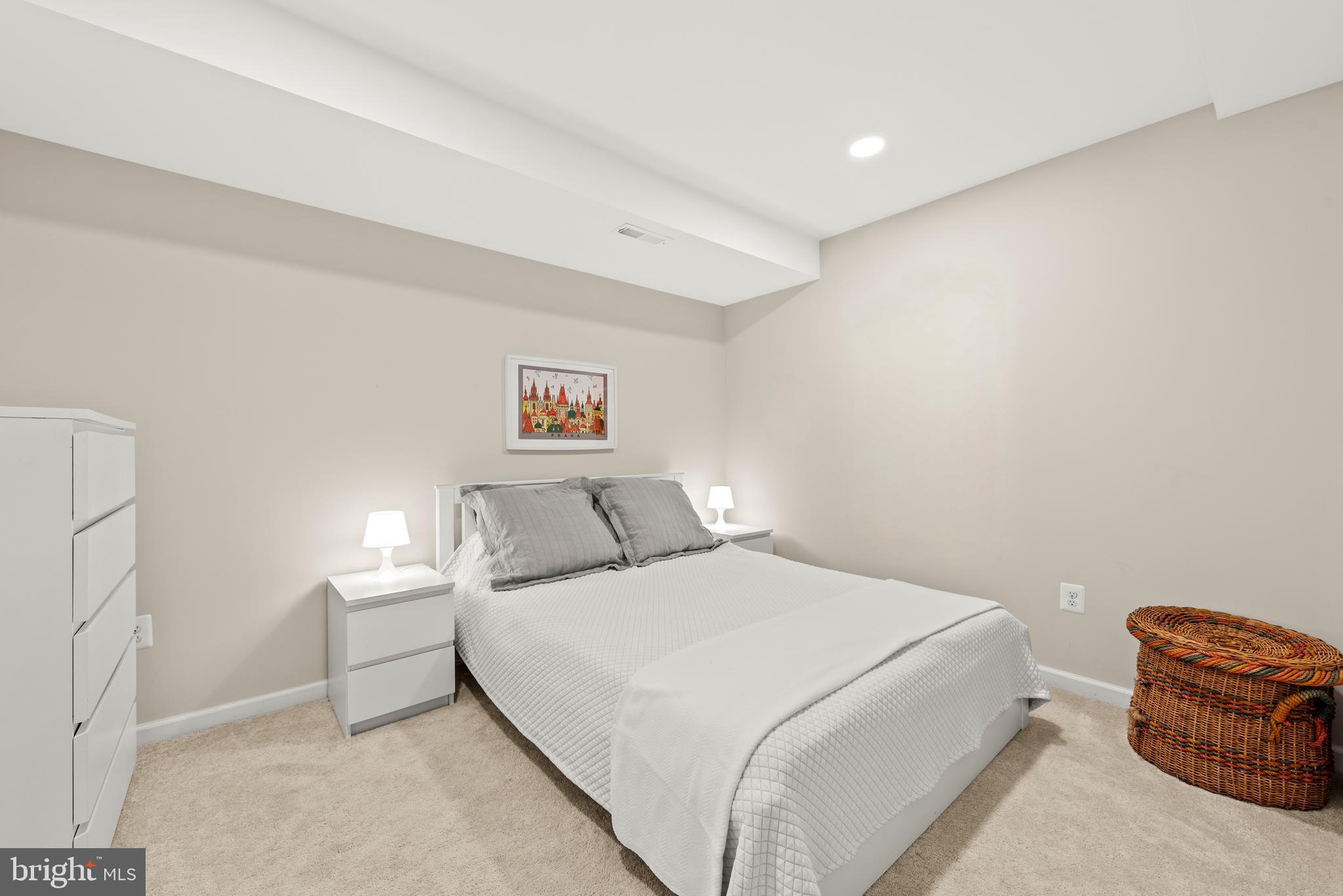 11612 Clipstone Lane Reston, VA 20191 - Photo 25 of 51 a bedroom with a bed and a chair