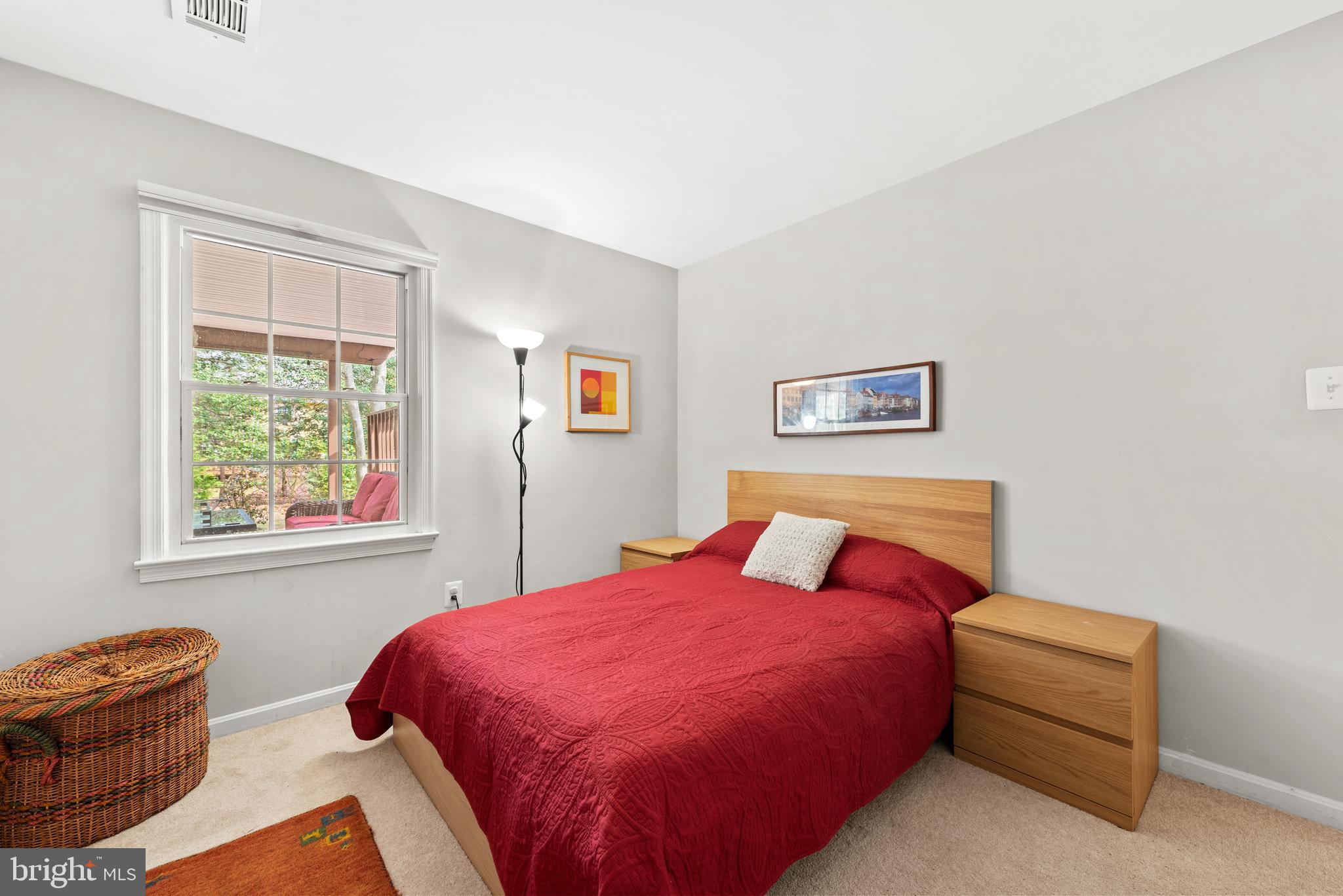 11612 Clipstone Lane Reston, VA 20191 - Photo 26 of 51 a bed sitting in a bedroom next to a window