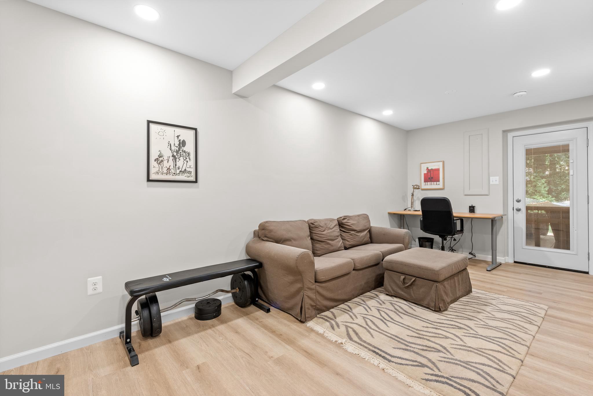 11612 Clipstone Lane Reston, VA 20191 - Photo 29 of 51 a living room with couches and a flat screen tv