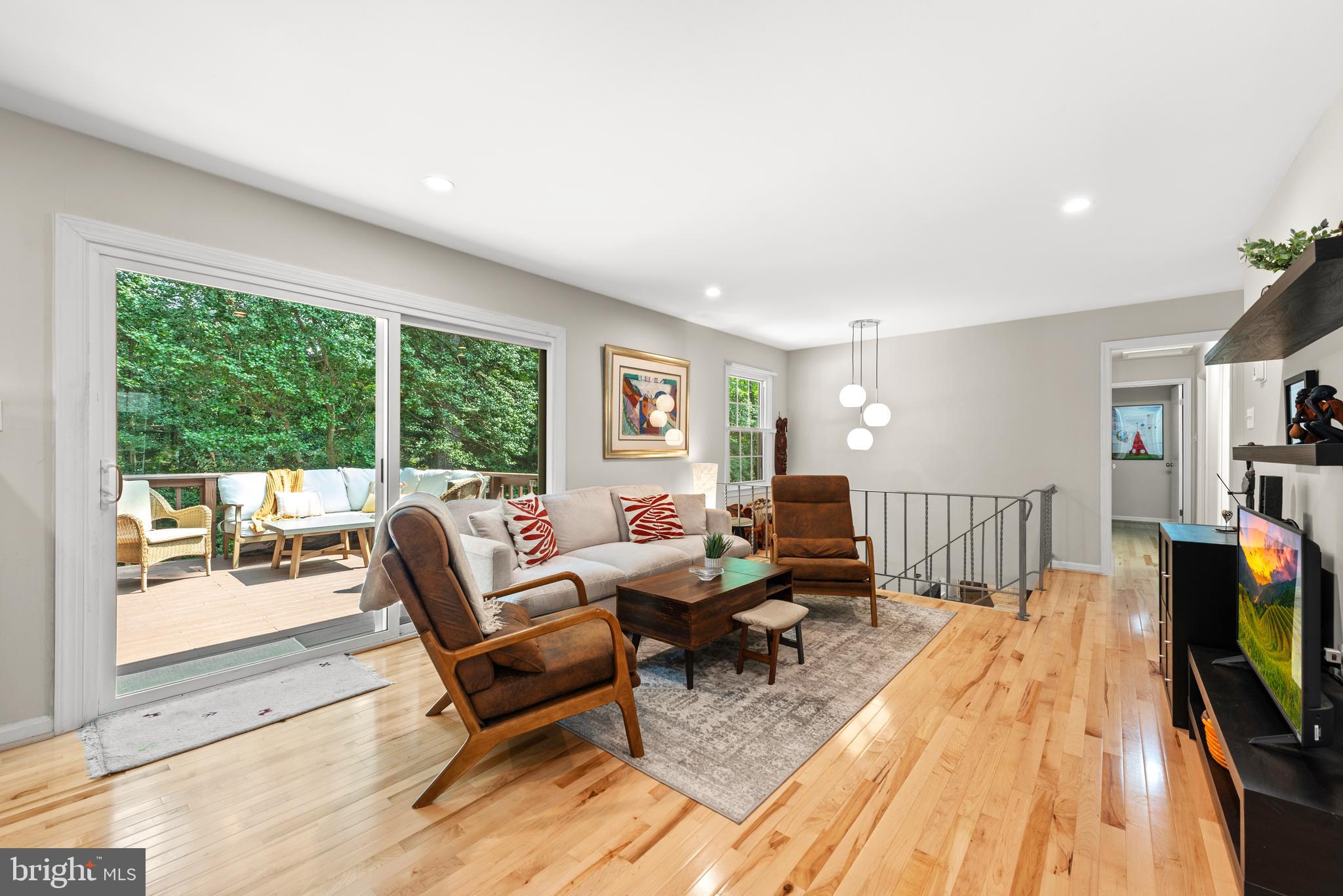 11612 Clipstone Lane Reston, VA 20191 - Photo 5 of 51 a living room with furniture and a flat screen tv